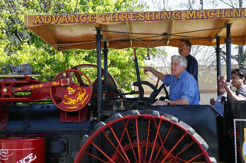 JayRiding with Jay Leno on his century-old threshing tractor. Jay particularly enjoys steam-engined vehicles because they take time to maintain and prepare for work or play. Conversely, he loves his early 20th-century electrics because they're so easy.